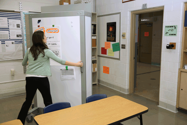 teacher moving barricade pro into position - school security solution